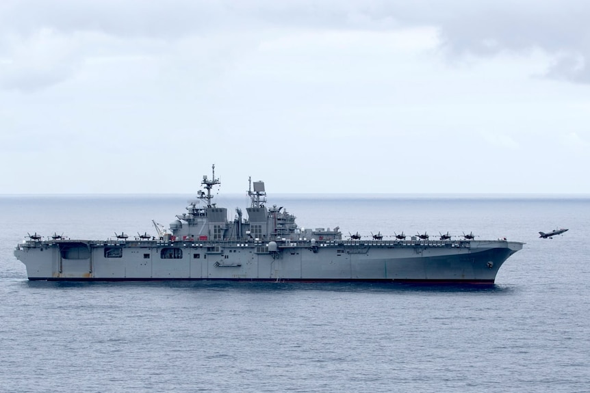 Jet takes off from a US Navy ship.