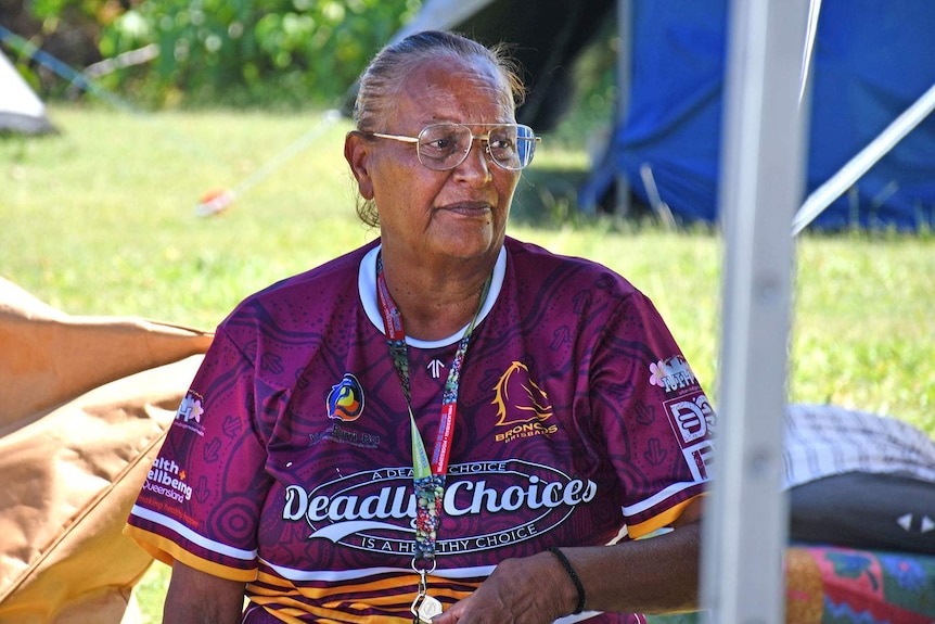 Quandamooka elder Maureen Myers sits at the Indigenous tent embassy.