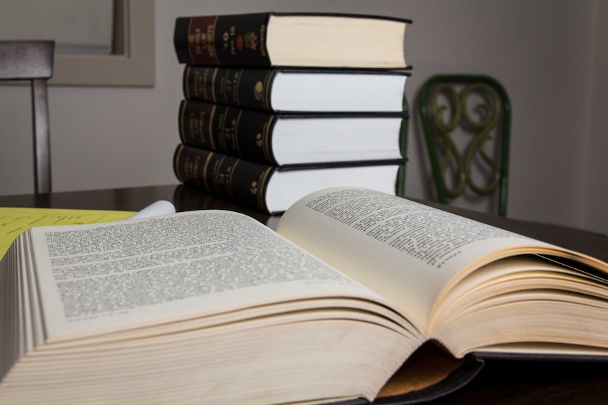 Law books sit on a table