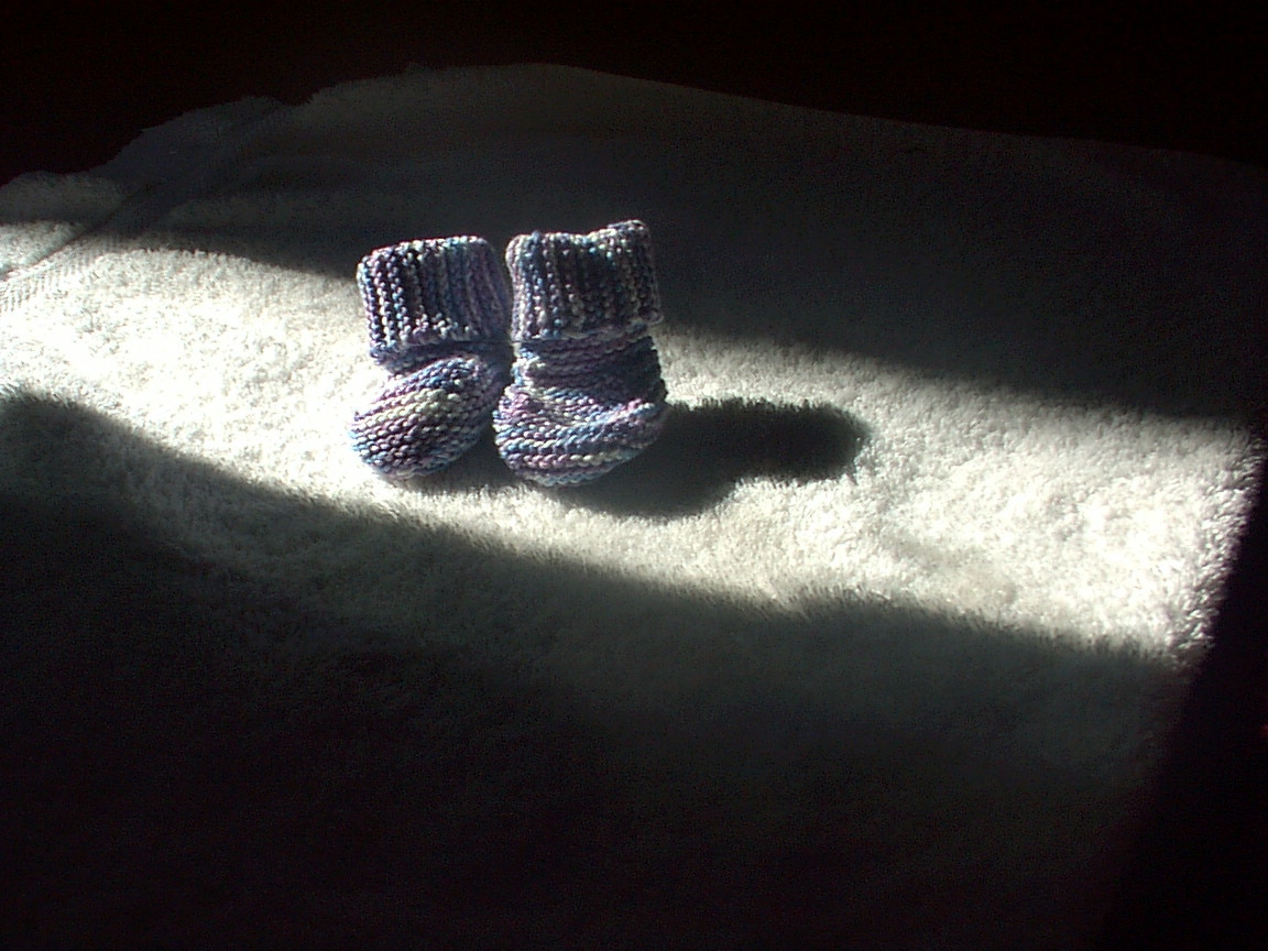 A pair of knitted baby booties