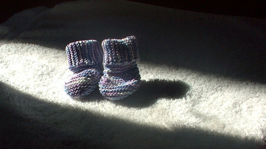 A pair of knitted baby booties