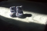 A pair of knitted baby booties