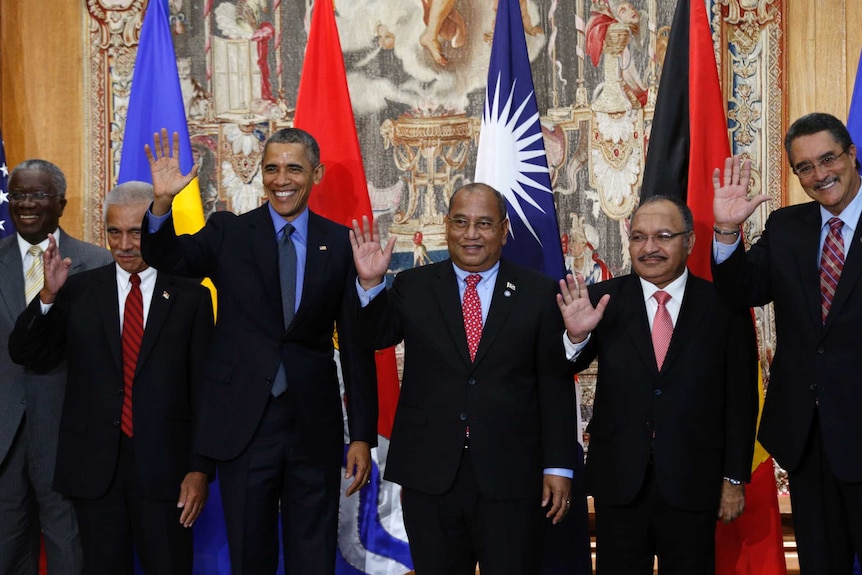 Obama poses for a family photo with leaders of island nations