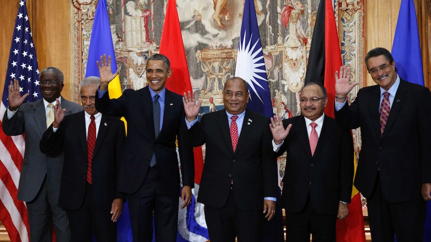 Obama poses for a family photo with leaders of island nations