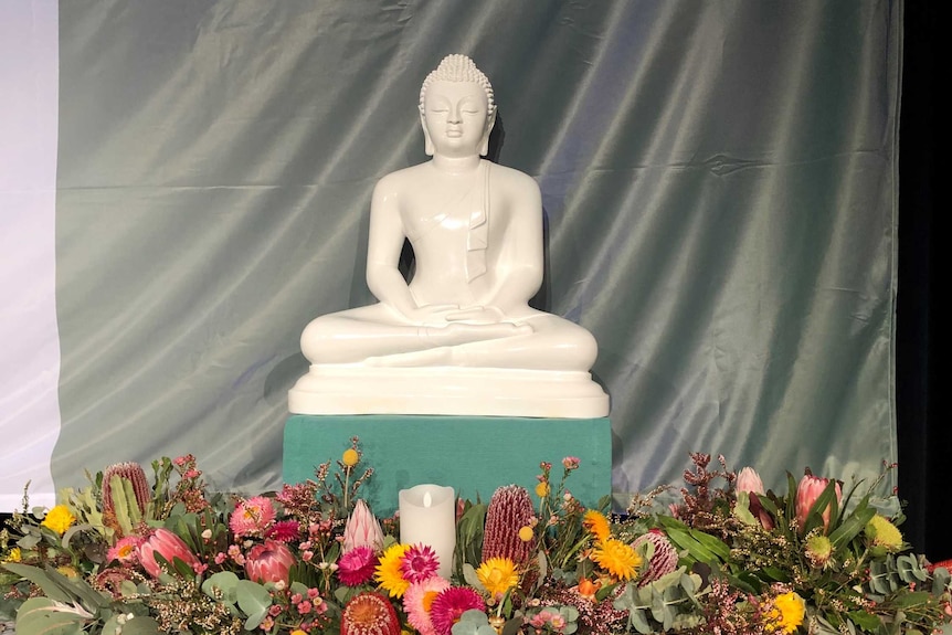 White statue of Buddha meditating