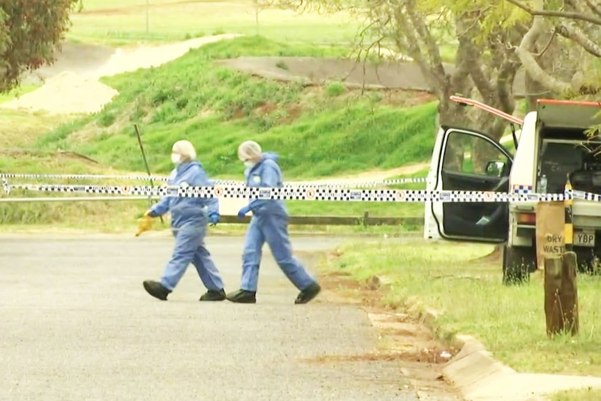 Forensic investigators at the scene of the death of a 27-year-old man in Toowoomba 