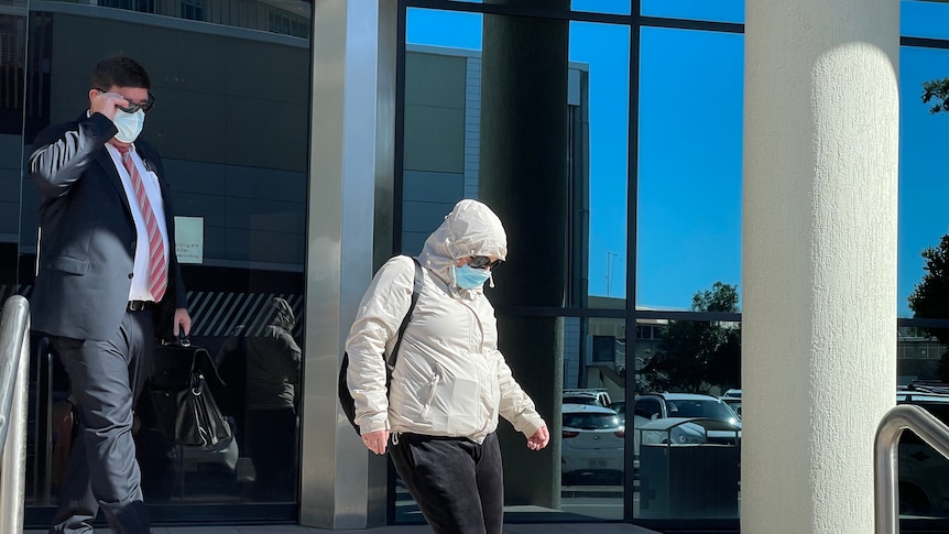 Psychologist Natasha Rosalie Hutchison leaving Maroochydore Court House hiding her face in mask and hoodie