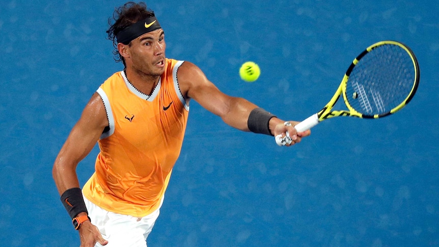 Spain's Rafael Nadal grimaces as he hits a forehand at the Australian Open.