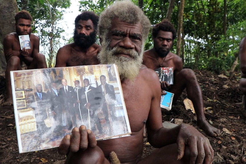 Chief Yapa from Ikunala village holds a photo of Prince Philip with Vanuatu Ambassadors