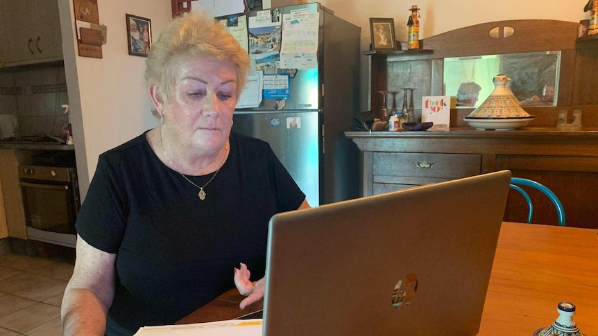 Northern Territory resident Sue Shearer sits at her laptop in her home in Darwin.