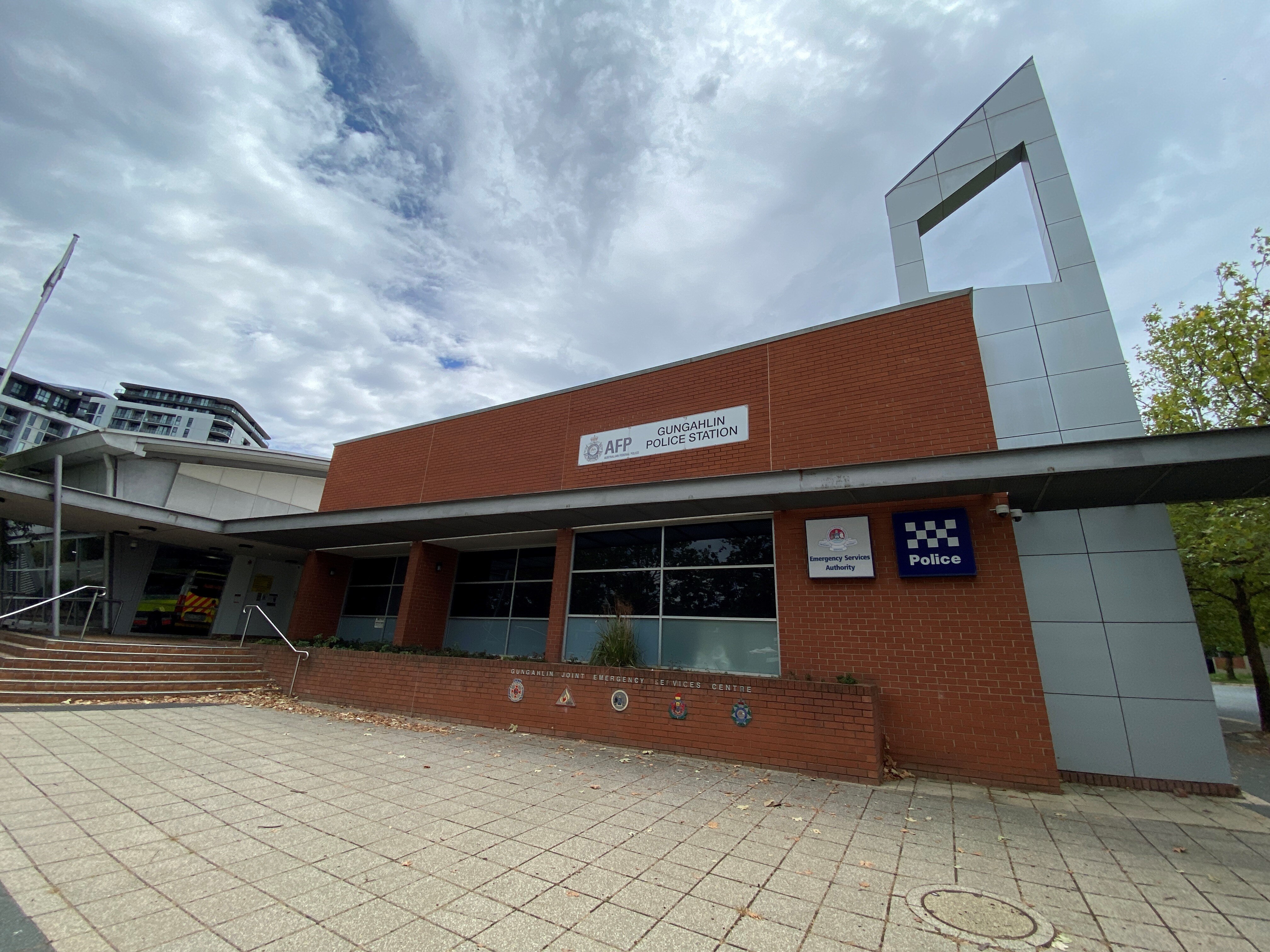 The exterior of a red brick police station.