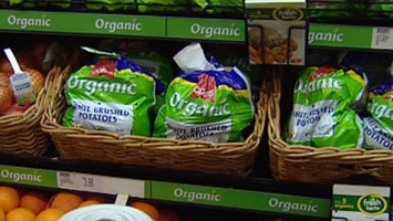 Organic vegetables displayed on the supermarket shel