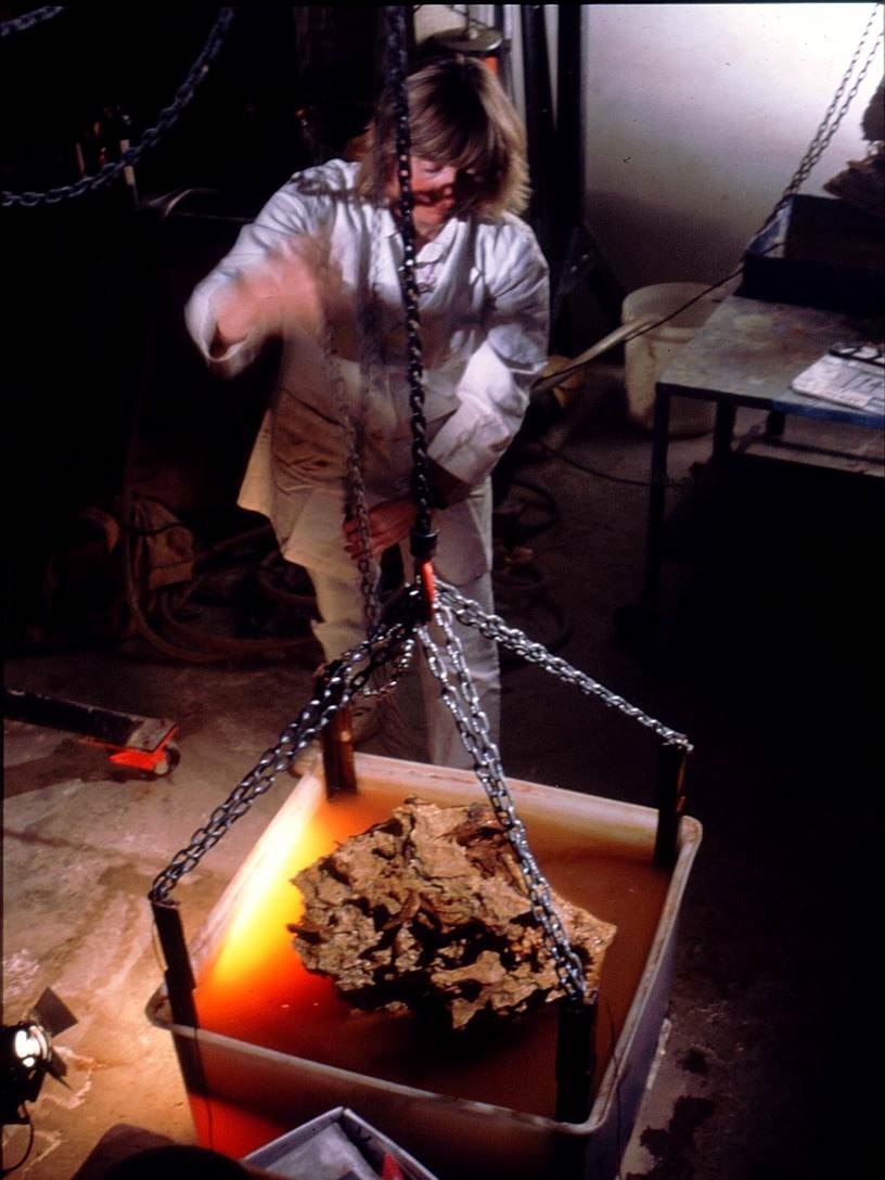 UNSW Preparator Dr Anna Gillespie dissolving limestone block from Riversleigh that is filled with bones