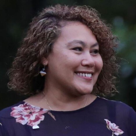Close shot of Karen Mundine, CEO of Reconciliation Australia, looking over her shoulder
