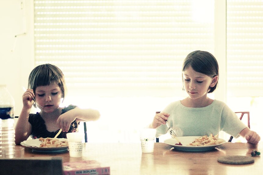 French children at the dinner table.