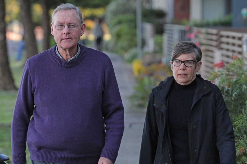 Simon and Helen Palfreeman walk down a footpath.