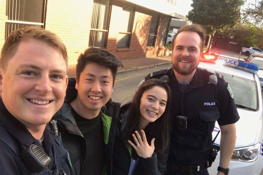 SAPOL officers pose for a photo with the happy couple.