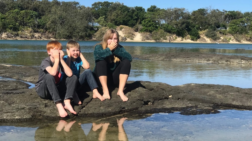 Anna's three children at the beach.