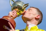 Mark Zahra kisses the Melbourne Cup