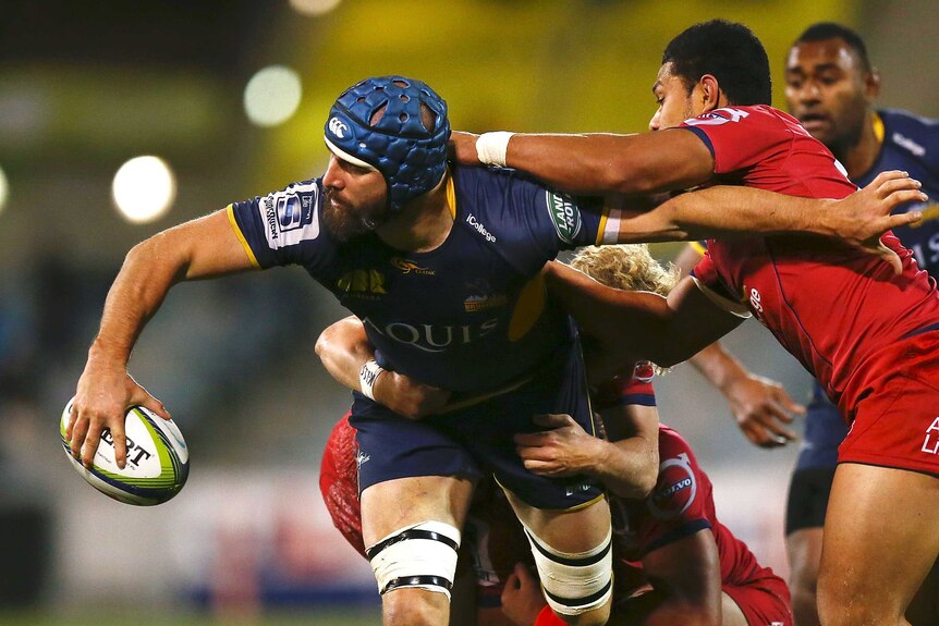 Scott Fardy offloads for the Brumbies