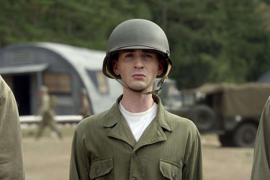 Steve Rogers stands in army uniform.