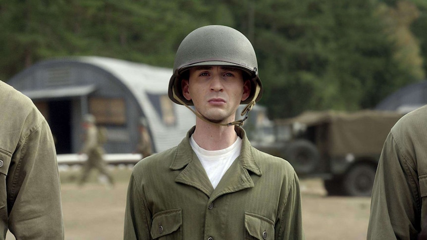 Steve Rogers stands in army uniform.