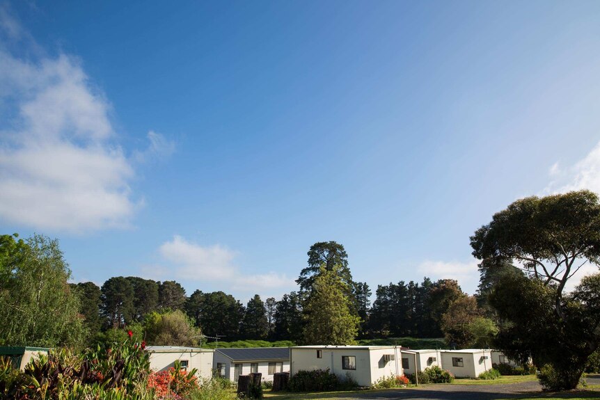 A view of the Wantirna caravan park indicates its leafy setting among gum trees and gardens.