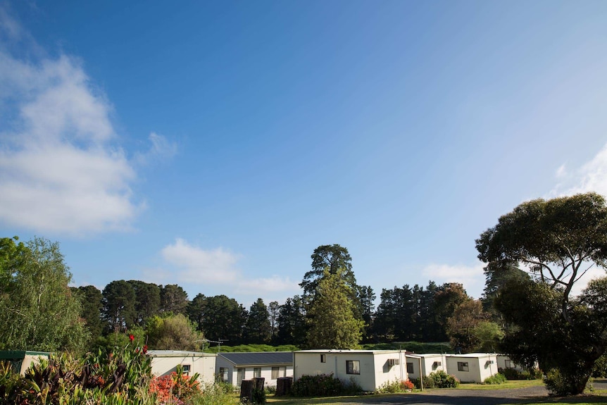 A view of the Wantirna Caravan Park indicates its leafy setting among gum trees and gardens.