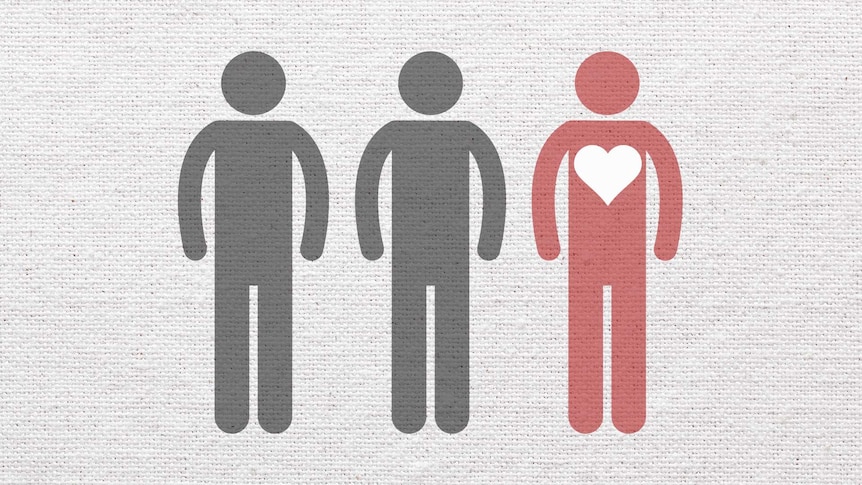 Three people symbols but one is red with a big heart on its torso.