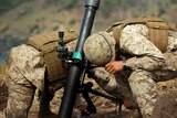 Marines fire a morter
