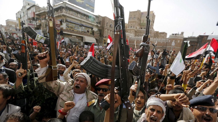 Armed Houthi followers rally against Saudi-led air strikes in Sanaa June 14, 2015