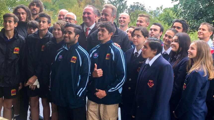 Students in the Clontarf boys program pose with Barnaby Joyce and Nigel Scullion