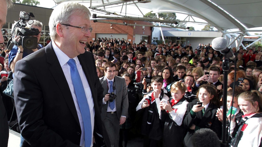 Kevin Rudd arrives at Aquinas College in Melbourne