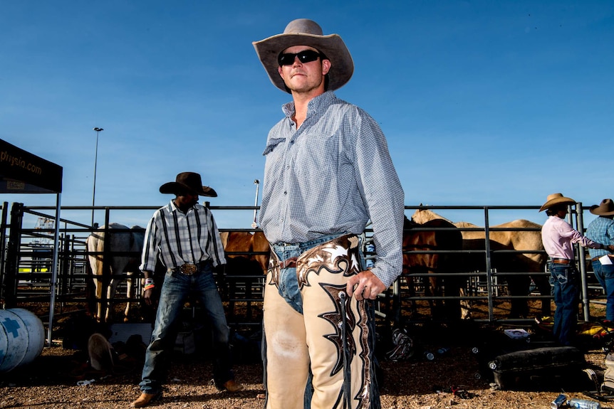 A rider poses for a photograph at the Mount Isa Rodeo.