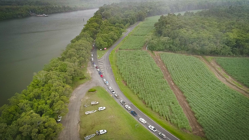 Aerial picture of cars lining up near river