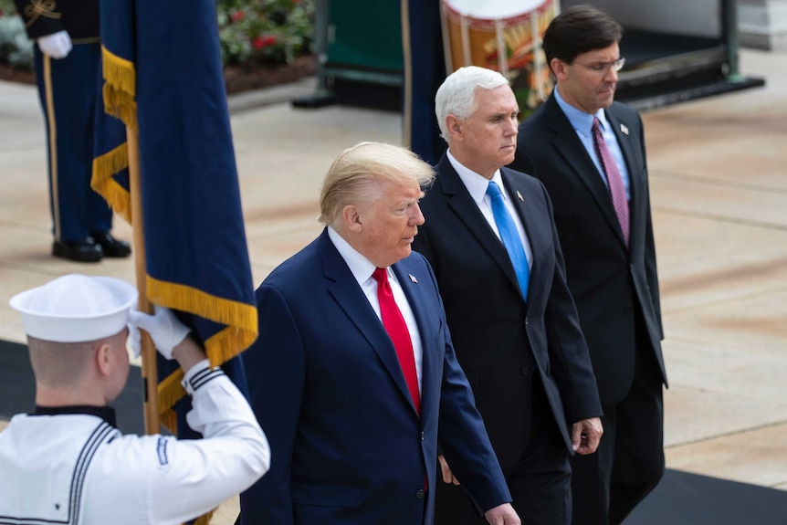President Donald Trump, Vice-President Mike Pence, and Defense Secretary Mark Esper at Arlington National Cemetery.