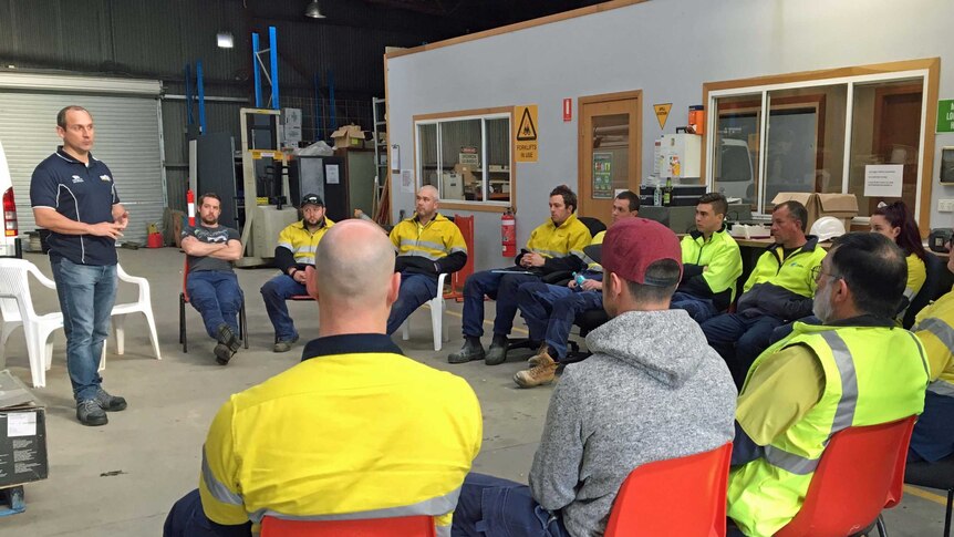 Workers at Russell Smith hold a meeting