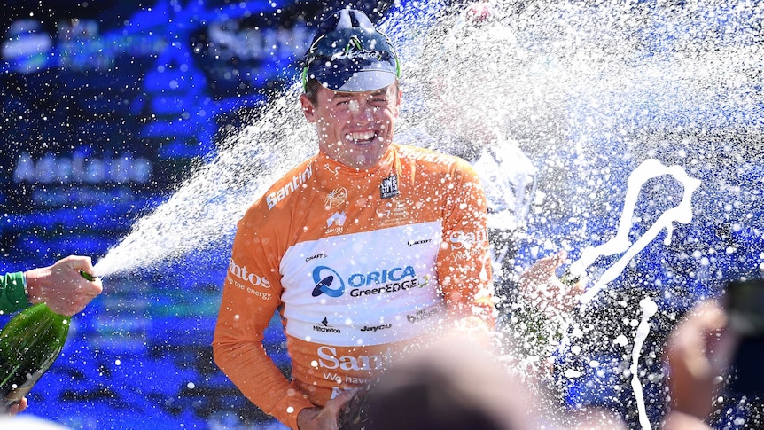 Simon Gerrans celebrates on the podium