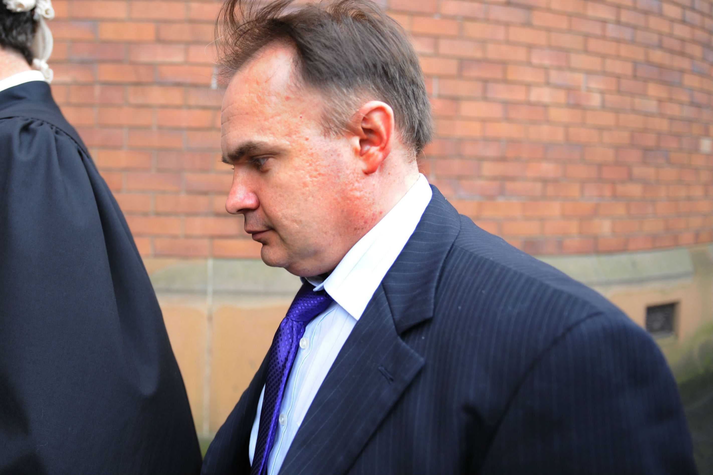 An alias and a dead man's name: Former ATO executive charged with fraud