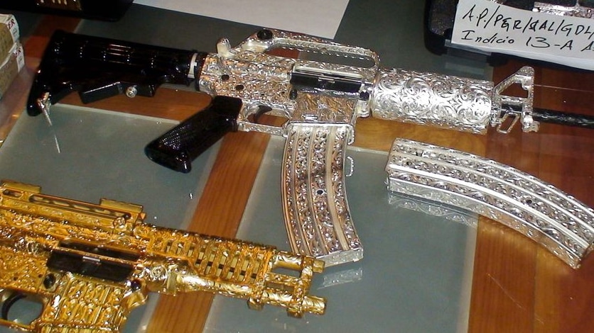 Police officers found 31 gold and silver-plated guns of varying calibre studded with diamonds.