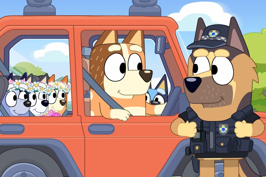 A still from Bluey that shows Chilli pulled over talking to a police officer dog. Bluey is in the front, three kids in the back