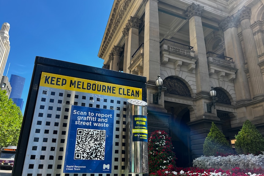 A fake QR code overlaying a QR code intended to report graffiti and street waste. 