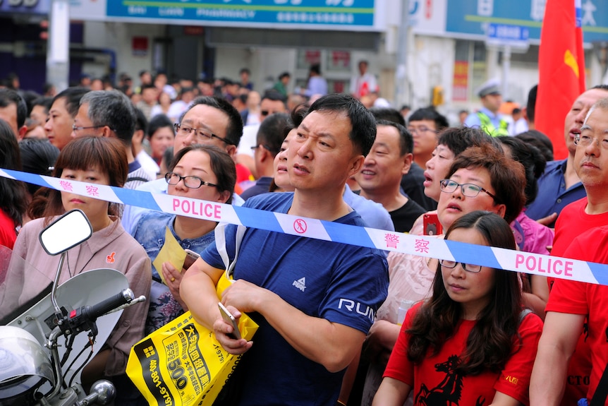 Chinese parents wait while their children take Gaokao, the Chinese college entrance exams.