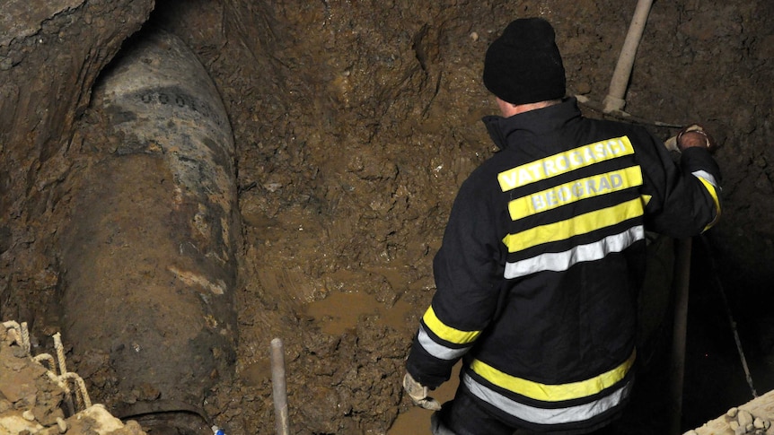 Emergency workers at the site of an unexploded bomb dating back to World War II in Belgrade