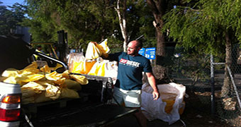 Albion resident Scott loads up on sandbags on February 18