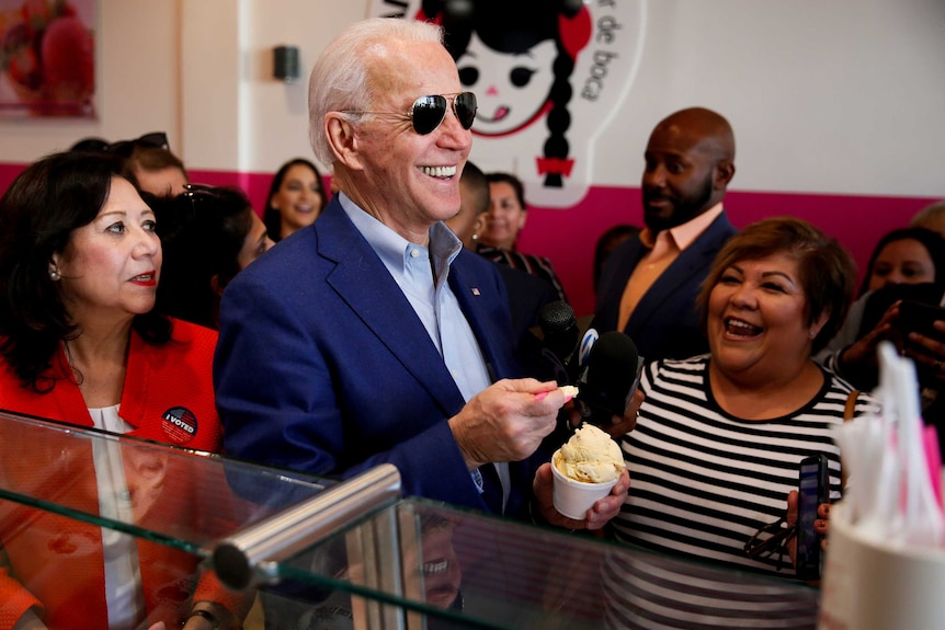 Joe Biden eating ice cream surrounded by fans