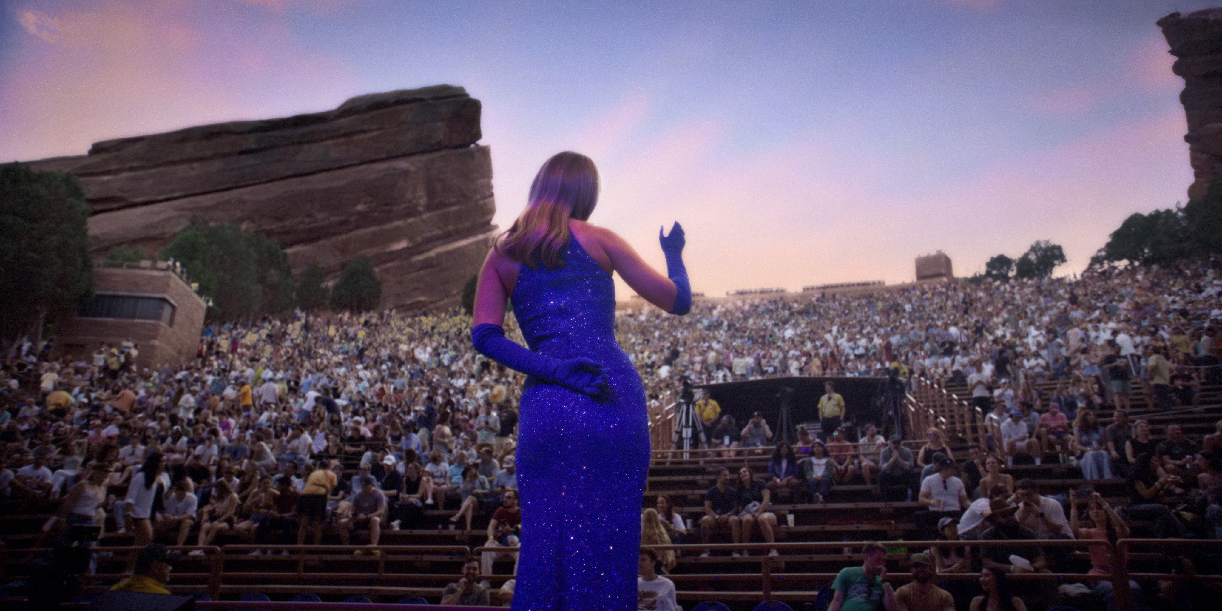 woman performing in front of a crowd