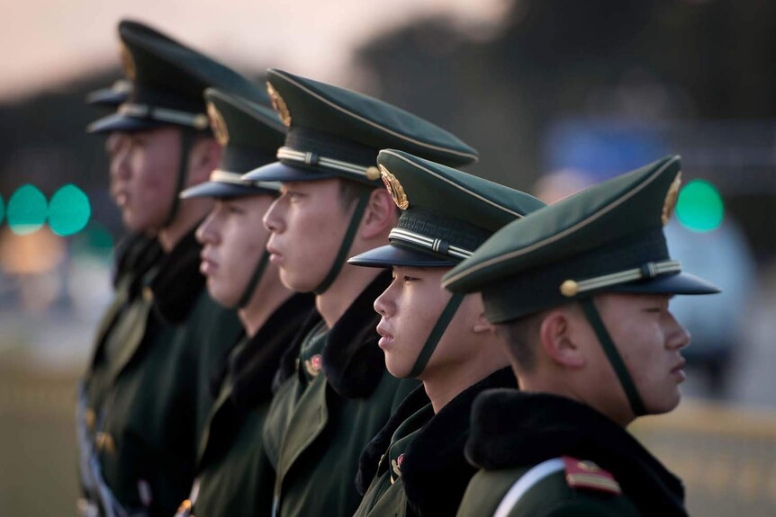Guards stand in Tiananmen Square in Beijing