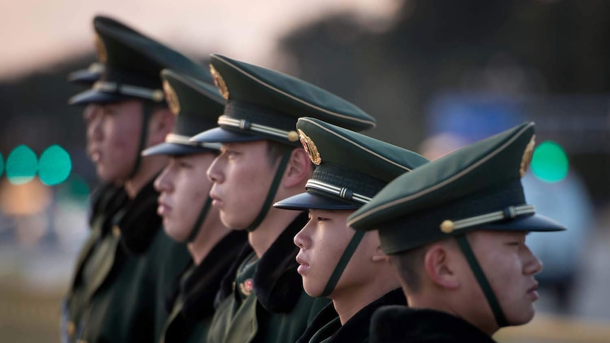 Guards stand in Tiananmen Square in Beijing