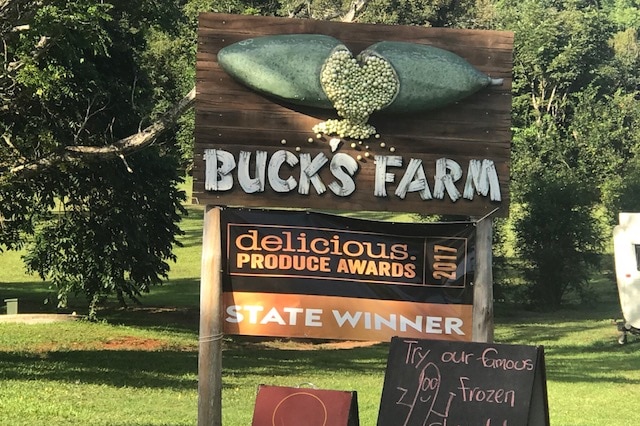 An entrance to a farm that says Buck's Farm.